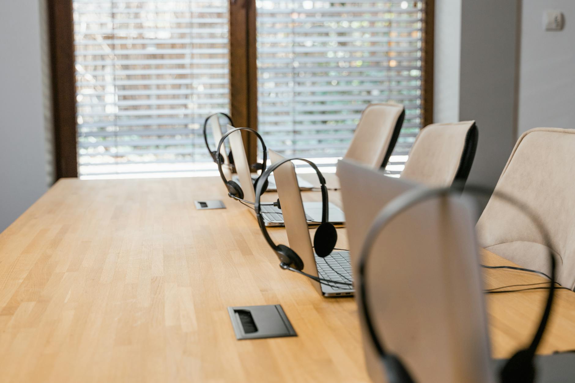 laptops and headsets on a table
